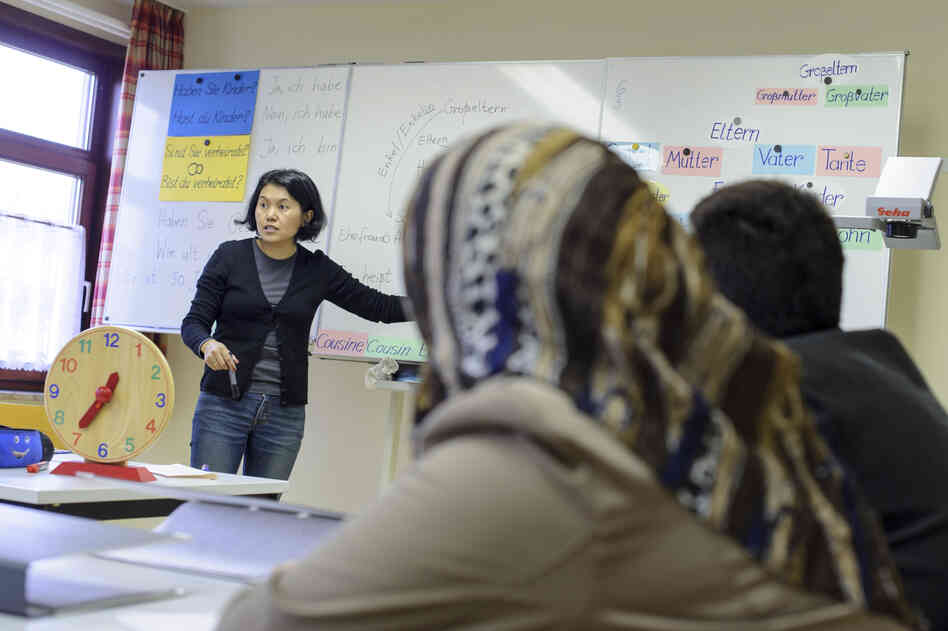 Syrian refugees participate in a German language class at the refugee center in Friedland, Germany, on Dec. 10. There are about 500 refugees at the camp, most of them Syrians. Syrian refugees participate in a German language class at the refugee center in Friedland, Germany, on Dec. 10. There are about 500 refugees at the camp, most of them Syrians.