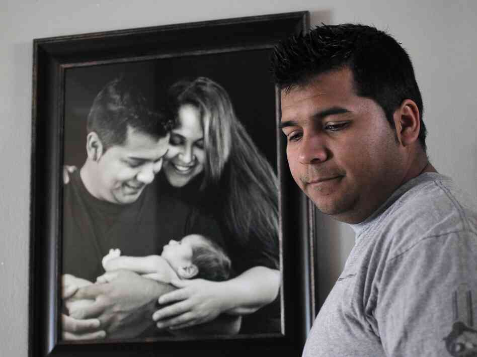 Erick Munoz stands by a photo of his wife, Marlise Munoz, at home in Fort Worth, Texas, on Jan. 3. She is being kept on life support in a local hospital against the family's wishes. Erick Munoz stands by a photo of his wife, Marlise Munoz, at home in Fort Worth, Texas, on Jan. 3. She is being kept on life support in a local hospital against the family's wishes.
