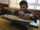 A blind child studies at the Braille Without Borders school in Lhasa, Tibet, in 2005. The program was the first of its kind in the country. A blind child studies at the Braille Without Borders school in Lhasa, Tibet, in 2005. The program was the first of its kind in the country.