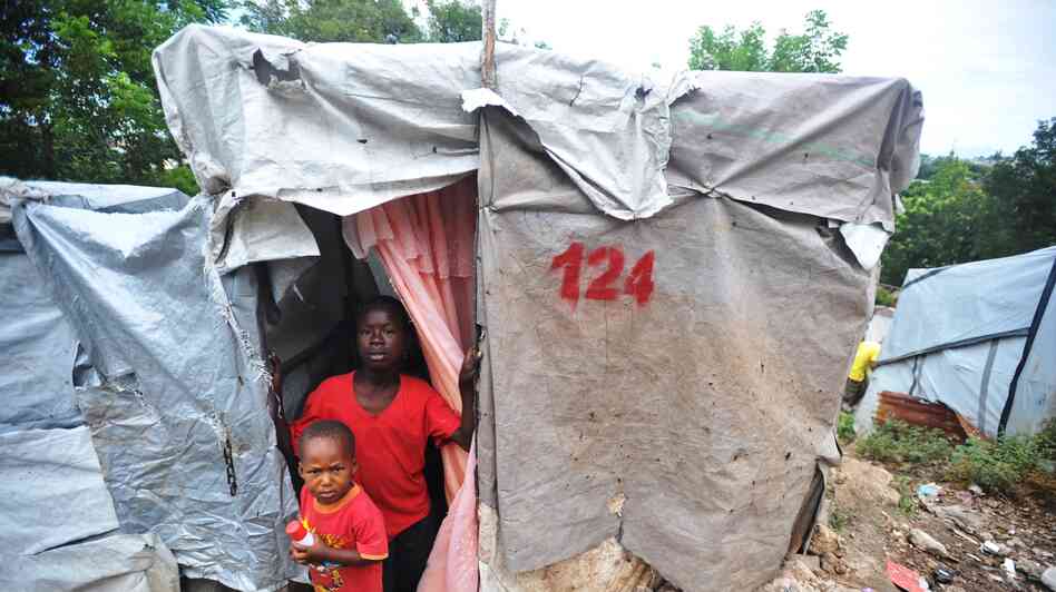 Boys at a camp for earthquake victims look out from their shelter in Petion-ville, Haiti, outside of Port-au-Prince in November. Boys at a camp for earthquake victims look out from their shelter in Petion-ville, Haiti, outside of Port-au-Prince in November.