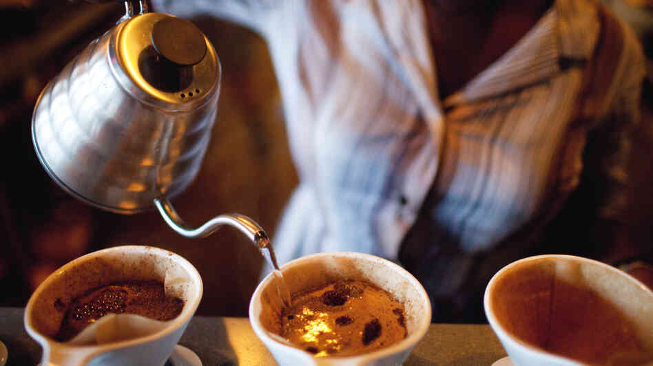 A barista makes coffee using the pour-over method at Artifact Coffee in Baltimore. A barista makes coffee using the pour-over method at Artifact Coffee in Baltimore.