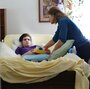 Marilyn Budzynski takes care of her 20-year-old son, Michael, in Eustis, Fla., in September. Michael suffers from Dravet syndrome, a severe form of epilepsy.