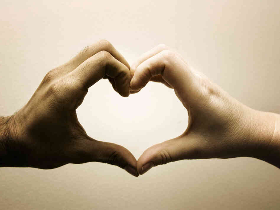 Two hands of different skin colors creating a heart, two hands of different skin colors intertwined. These are the types of images found in stock photo databases that are tagged "interracial romance." Two hands of different skin colors creating a heart, two hands of different skin colors intertwined. These are the types of images found in stock photo databases that are tagged "interracial romance."