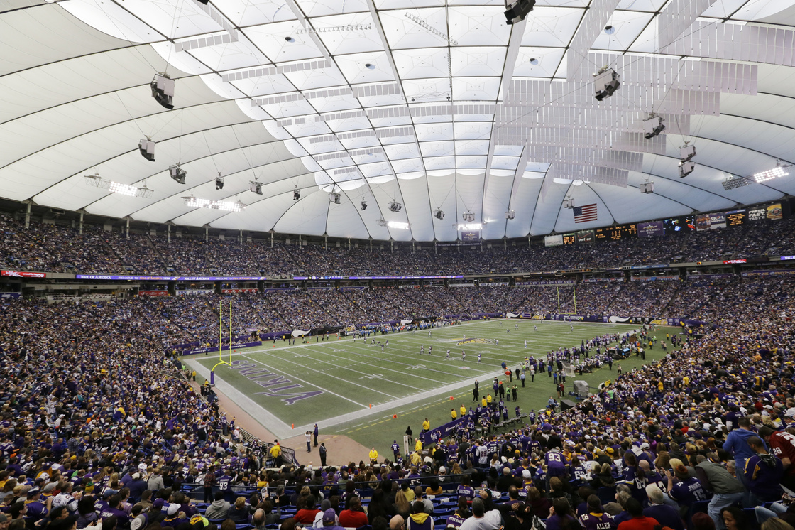 Fans cheer during the last NFL football game played at the Metrodome in Minneapolis.