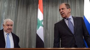 Syrian Foreign Minister Walid Muallem (left) and Russian Foreign Minister Sergei Lavrov attend a press conference in Moscow on Friday.