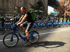 A major supplier to bike-sharing companies declared for bankruptcy this week — but experts say they still see the services spreading. Here, a man rides a Citibike through the Dumbo district of Brooklyn. A major supplier to bike-sharing companies declared for bankruptcy this week — but experts say they still see the services spreading. Here, a man rides a Citibike through the Dumbo district of Brooklyn.