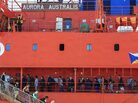 Back home: Passengers disembark from the icebreaker Aurora Australis at a harbor in Hobart, Australia, on Wednesday. The ship brought 52 scientists and adventure tourists back to Australia from Antarctica, where the ship they had been on got stuck in ice. Back home: Passengers disembark from the icebreaker Aurora Australis at a harbor in Hobart, Australia, on Wednesday. The ship brought 52 scientists and adventure tourists back to Australia from Antarctica, where the ship they had been on got stuck in ice.