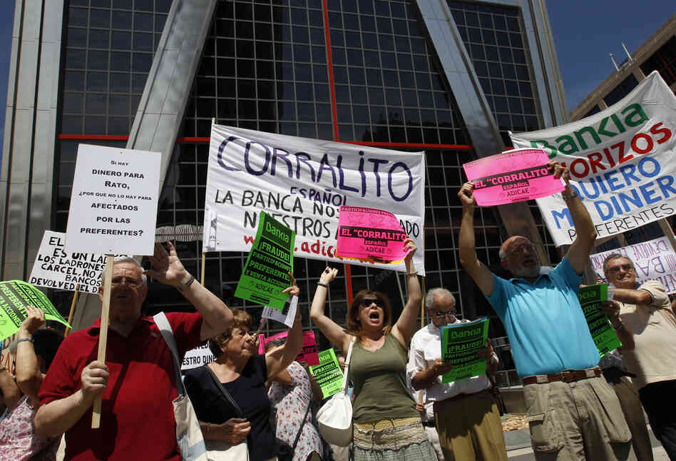 Shareholders protest bank practices at the headquarters of Spain's largest mortgage lender, Bankia, in Madrid on June 23, 2012, at the height of the country's banking crisis. Europe stepped in at that time with $56 billion in loans to help the banking system. Shareholders protest bank practices at the headquarters of Spain's largest mortgage lender, Bankia, in Madrid on June 23, 2012, at the height of the country's banking crisis. Europe stepped in at that time with $56 billion in loans to help the banking system.