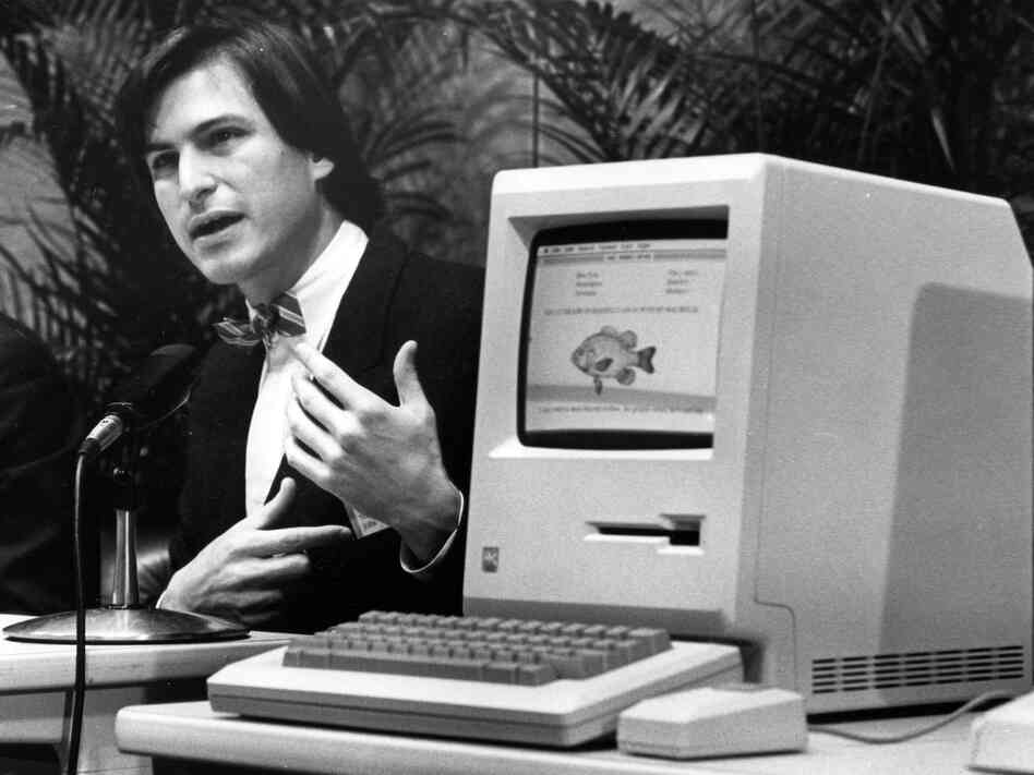 Steve Jobs, the late founder and former CEO of Apple, announces the Apple Macintosh computer at a shareholders meeting on Jan. 24, 1984, in California. Steve Jobs, the late founder and former CEO of Apple, announces the Apple Macintosh computer at a shareholders meeting on Jan. 24, 1984, in California.