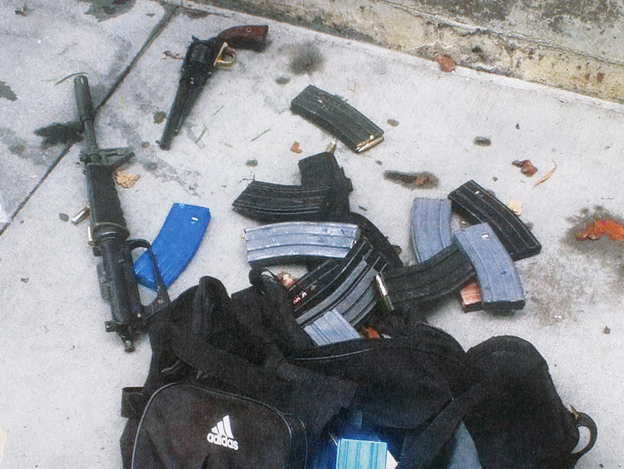 This handout provided by the Santa Monica Police Department shows ammunition, magazines and guns believed to have been dropped by a suspected gunman during a mass shooting at Santa Monica College in June, 2013. (Image credit: Getty Images)