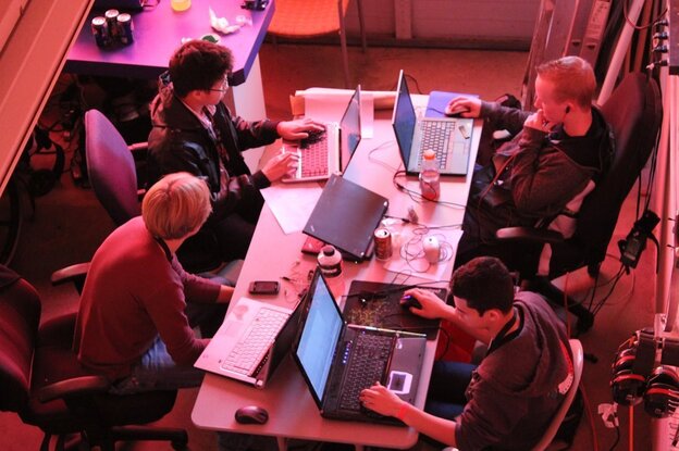 A group called StudentRND throws 24-hour code-a-thons for programmers of all backgrounds and skill levels. Coders show up at noon on Saturday, pitch ideas, form teams and code through the night trying to finish by noon on Sunday. Above, StudentRND participants work at a 2011 CodeDay in Seattle. (Image credit: StudentRND)