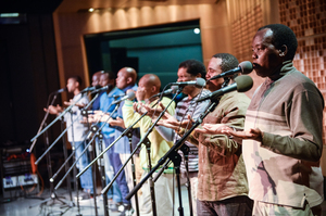 The group performs "Homeless," the song that Paul Simon recorded for his album Graceland.