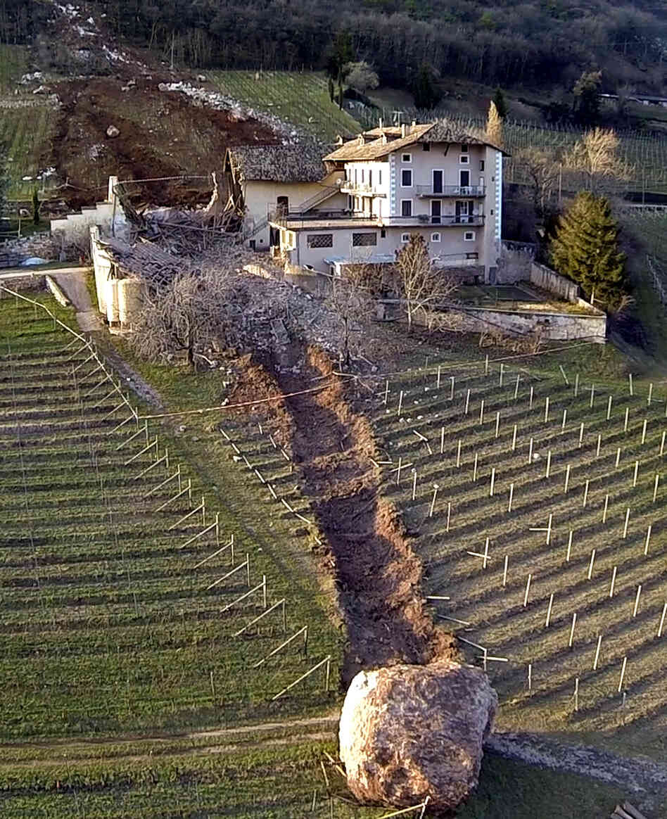 The path of destruction can be clearly seen at this farm in northern Italy, where a boulder broke loose from a mountain and rolled down and through a barn. Fortunately, no one was hurt. The path of destruction can be clearly seen at this farm in northern Italy, where a boulder broke loose from a mountain and rolled down and through a barn. Fortunately, no one was hurt.