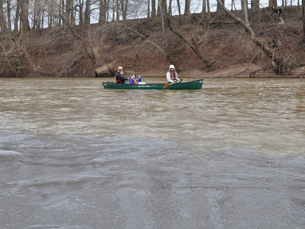 Volunteers with the Dan River Basin Association, graduate students from Duke University and staff with the environmental group Appalachian Voices collect water samples on the Dan River after a massive coal ash spill. (Image credit: Appalachian Voices )