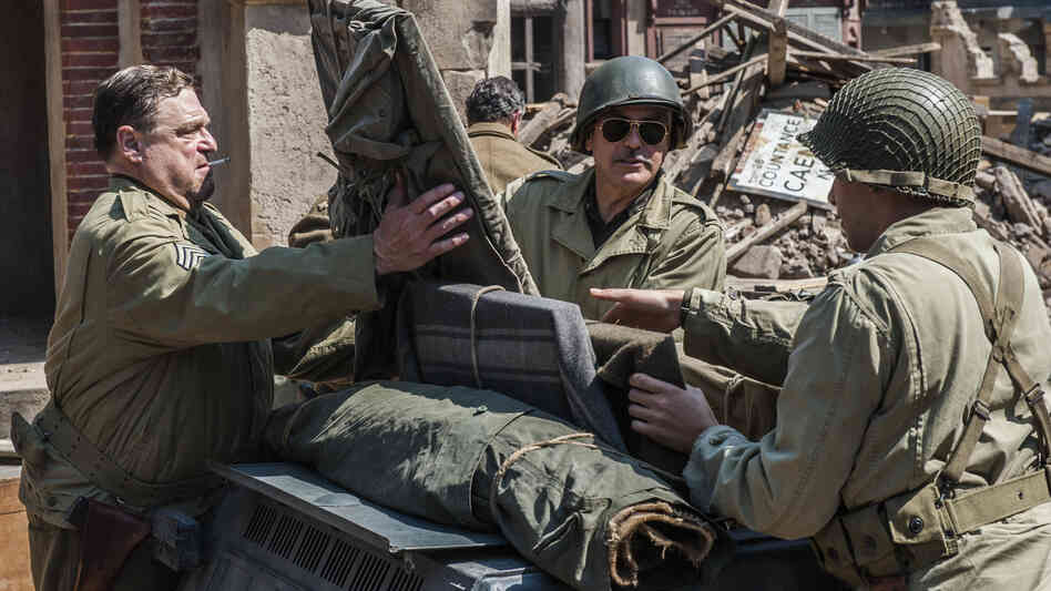Frank Stokes (George Clooney), Walter Garfield (John Goodman) and Sam Epstein (Dimitri Leonidas) are part of a World War II platoon ordered to rescue stolen art from the Nazis in The Monuments Men, directed by George Clooney. Frank Stokes (George Clooney), Walter Garfield (John Goodman) and Sam Epstein (Dimitri Leonidas) are part of a World War II platoon ordered to rescue stolen art from the Nazis in The Monuments Men, directed by George Clooney.