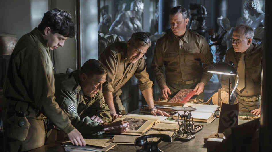 George Clooney (center) stars alongside Dimitri Leonidas, John Goodman, Matt Damon and Bob Balaban in the World War II drama The Monuments Men, inspired by the true tale of an Army unit charged with recovering art stolen by the Nazi regime. George Clooney (center) stars alongside Dimitri Leonidas, John Goodman, Matt Damon and Bob Balaban in the World War II drama The Monuments Men, inspired by the true tale of an Army unit charged with recovering art stolen by the Nazi regime.