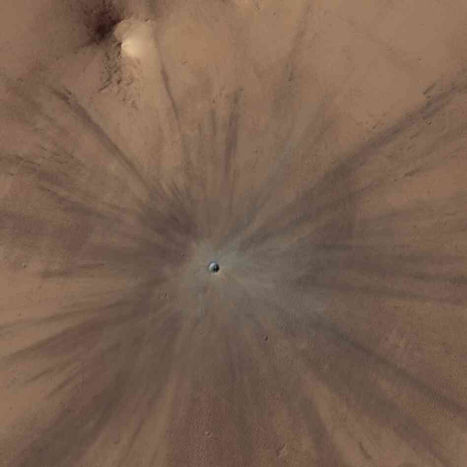 A true-color image of the same crater. A true-color image of the same crater.