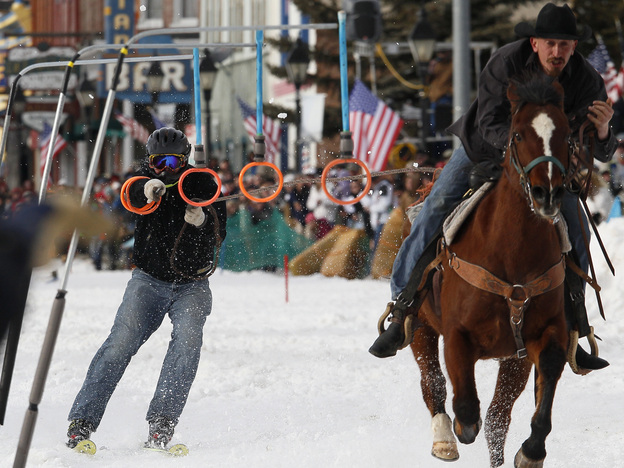 A horseman pulls a skier down the street in Leadville, Colo., in March, during the city's annual skijoring event. It was the event's 62nd year. (Image credit: Reuters/Landov)