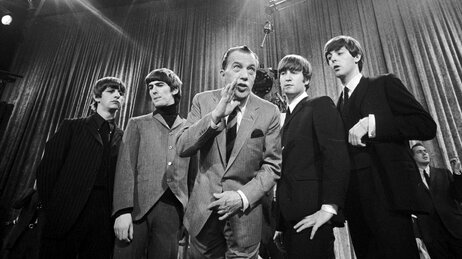 Ed Sullivan (center) stands with The Beatles during a rehearsal for the British group's first American appearance, on the Ed Sullivan Show, in New York on Feb. 9, 1964. Ed Sullivan (center) stands with The Beatles during a rehearsal for the British group's first American appearance, on the Ed Sullivan Show, in New York on Feb. 9, 1964.