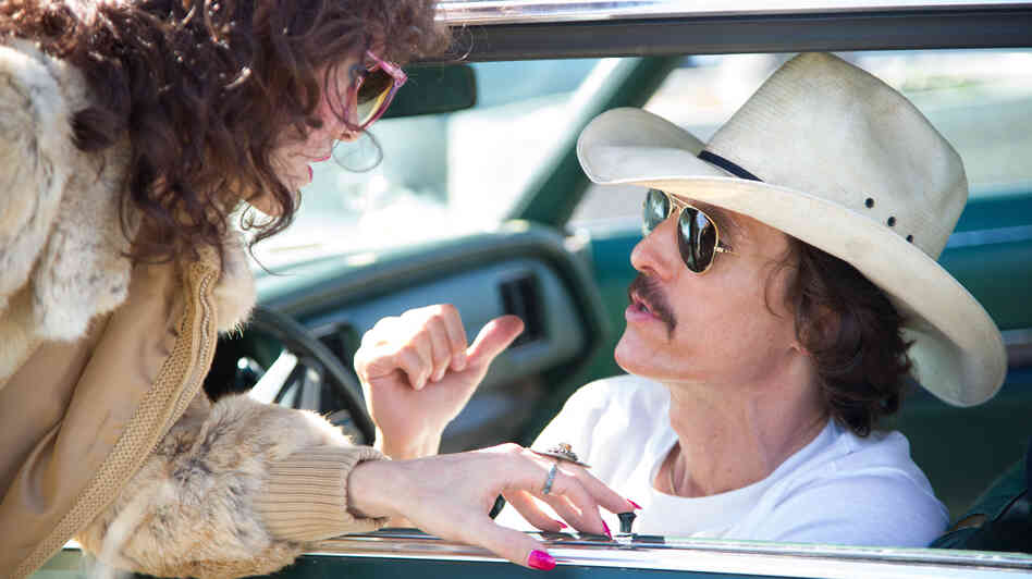 Rayon (Jared Leto) and Ron Woodroof (Matthew McConaughey) are fellow AIDS patients smuggling alternative medications into the U.S. in Dallas Buyers Club, directed by Jean-Marc Vallée. Rayon (Jared Leto) and Ron Woodroof (Matthew McConaughey) are fellow AIDS patients smuggling alternative medications into the U.S. in Dallas Buyers Club, directed by Jean-Marc Vallée.
