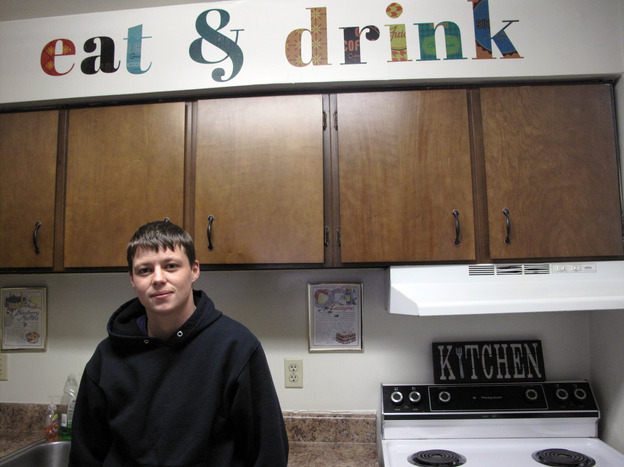 Melissa Conklin, 23, stands in the kitchen of her two-bedroom apartment at Woodmere Trace in Norfolk, Va. She earns about $30,000 a year at a nearby car dealership, and says these apartments are not only convenient, but affordable. She pays about $900 a month here, far less than other apartments in the area. (Image credit: NPR)