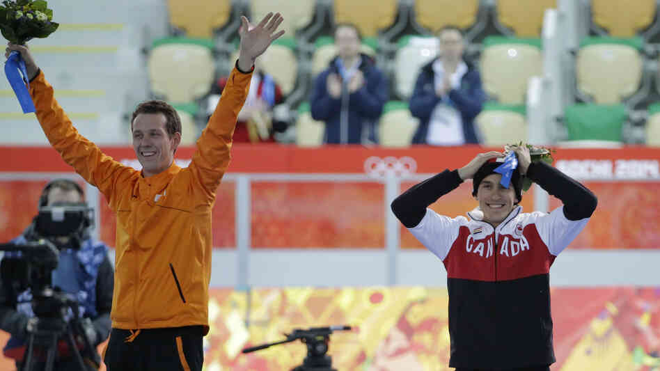 Silver medalist Denny Morrison of Canada celebrates his feat, made possible after a teammate gave him a slot in Wednesday's 1,000-meter speedskating race in Sochi. Morrison stands next to gold medalist Stefan Groothuis of the Netherlands. Silver medalist Denny Morrison of Canada celebrates his feat, made possible after a teammate gave him a slot in Wednesday's 1,000-meter speedskating race in Sochi. Morrison stands next to gold medalist Stefan Groothuis of the Netherlands.