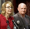 Former Arizona Rep. Gabrielle Giffords, accompanied by her husband, retired astronaut Mark Kelly, speaks during a July 2013 news conference in Manchester, N.H. Former Arizona Rep. Gabrielle Giffords, accompanied by her husband, retired astronaut Mark Kelly, speaks during a July 2013 news conference in Manchester, N.H.