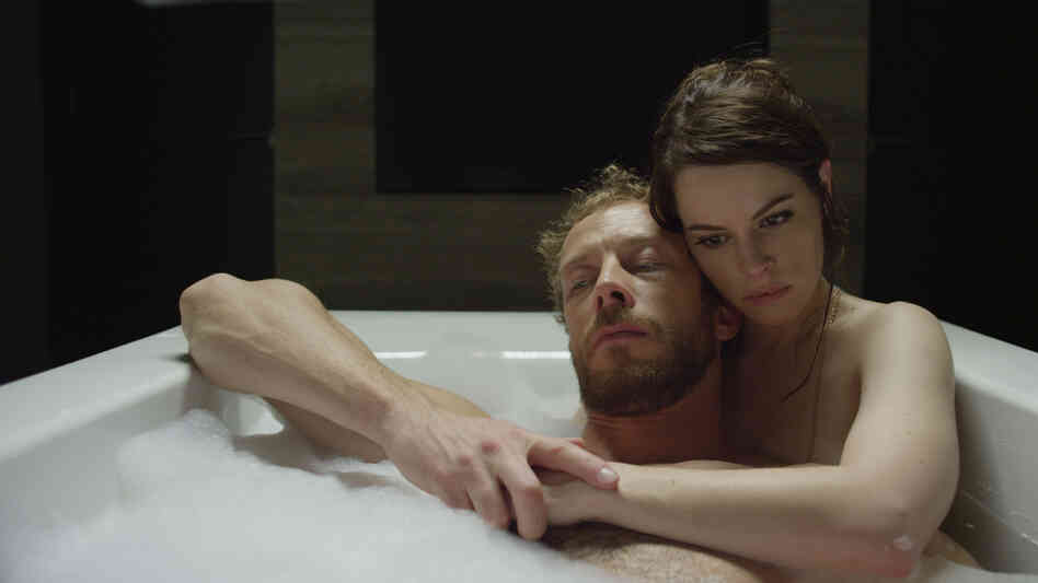 Kate (Emily Hampshire) treats the victims of zombie attacks — among them her husband, Alex (Kris Holden-Reid), in a world where medication can keep the zombie-bitten human, but supplies may be running low. Kate (Emily Hampshire) treats the victims of zombie attacks — among them her husband, Alex (Kris Holden-Reid), in a world where medication can keep the zombie-bitten human, but supplies may be running low.