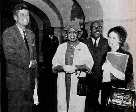 Then-Fashion Fair director Freda DeKnight (center) stands with President John F. Kennedy when the models visited the White House. The photo was featured in the Oct. 26, 1961, issue of Jet Magazine. Then-Fashion Fair director Freda DeKnight (center) stands with President John F. Kennedy when the models visited the White House. The photo was featured in the Oct. 26, 1961, issue of Jet Magazine.