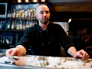 Fishmonger MJ Gimbar serves up some oysters at BlackSalt Fish Market & Restaurant in Washington, D.C.