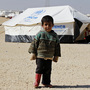 A Syrian refugee boy stands outside his tent at Al Zaatri refugee camp in the Jordanian city of Mafraq, near the border with Syria, earlier this week. A Syrian refugee boy stands outside his tent at Al Zaatri refugee camp in the Jordanian city of Mafraq, near the border with Syria, earlier this week.