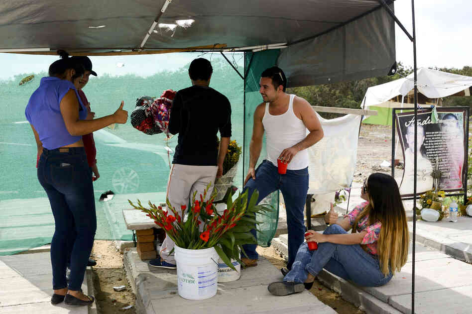 A group of youths spend a Sunday afternoon at their friend's tomb drinking and singing narcocorridos (ballads that celebrate the life and exploits of drug traffickers). Christina (right), a 21-year-old psychology student, says drug trafficking is a way of life in Sinaloa. A group of youths spend a Sunday afternoon at their friend's tomb drinking and singing narcocorridos (ballads that celebrate the life and exploits of drug traffickers). Christina (right), a 21-year-old psychology student, says drug trafficking is a way of life in Sinaloa.