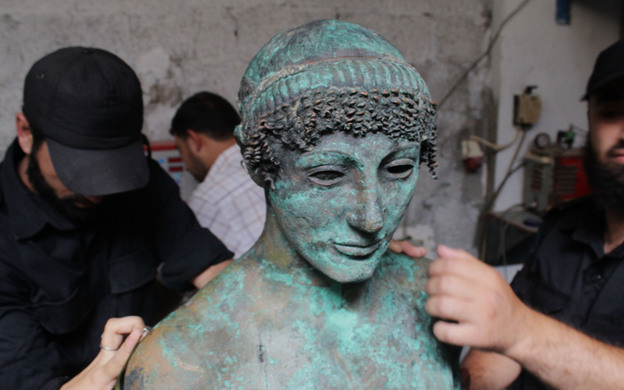 Last year, a Palestinian man fishing off the coast of the Gaza Strip discovered what is thought to be a 2,500-year-old bronze statue of the Greek god Apollo. The rare statue vanished from public view almost immediately after being pulled from the sea. The Hamas government in Gaza says it now has control of the statue. (Image credit: APA/Landov)