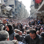 Masses of refugees wait in line to receive food aid distributed in the Yarmouk camp on Jan. 31 in Damascus, Syria. Masses of refugees wait in line to receive food aid distributed in the Yarmouk camp on Jan. 31 in Damascus, Syria.