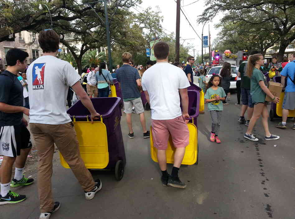 Volunteers for the organization Arc of Greater New Orleans collect leftover beads to resell. Volunteers for the organization Arc of Greater New Orleans collect leftover beads to resell.