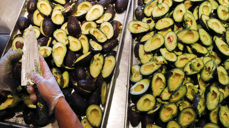 An employee prepares to make fresh guacamole at a Chipotle restaurant in Hollywood, Calif. An employee prepares to make fresh guacamole at a Chipotle restaurant in Hollywood, Calif.