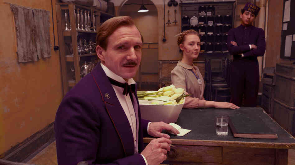 Gustave H. (Ralph Fiennes, with Saoirse Ronan and Tony Revolori) is a hotel concierge in an Eastern Europe falling under Hitler's shadow — a man pining for the Old World sensibility that's fading all around him. Gustave H. (Ralph Fiennes, with Saoirse Ronan and Tony Revolori) is a hotel concierge in an Eastern Europe falling under Hitler's shadow — a man pining for the Old World sensibility that's fading all around him.