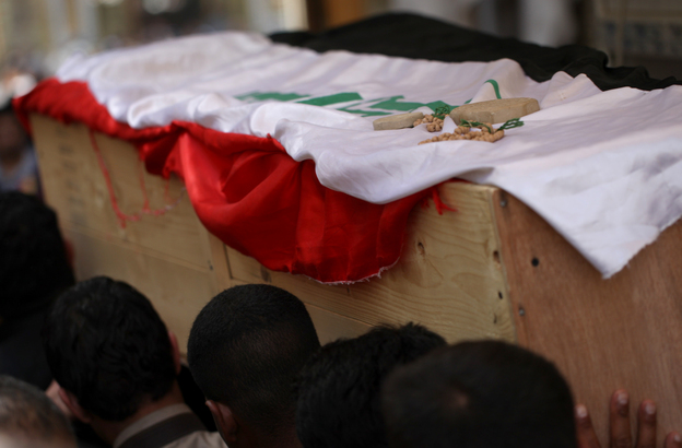 Iraqi Shiite mourners carry the coffin of a soldier killed in clashes with anti-government fighters in Fallujah earlier this month. The government faces a months-long crisis in Anbar province, where it has lost the city of Fallujah as well as shifting parts of provincial capital Ramadi to anti-government militants. (Image credit: AFP/Getty Images)