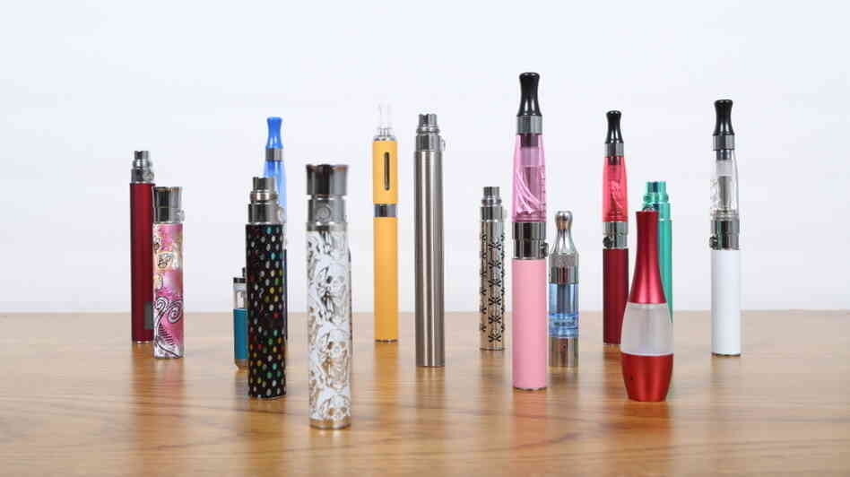Some employees say e-cigarettes increase their productivity and help them steer clear of tobacco. But health regulators are looking into possible risks to e-cig users — and to co-workers. Some employees say e-cigarettes increase their productivity and help them steer clear of tobacco. But health regulators are looking into possible risks to e-cig users — and to co-workers.