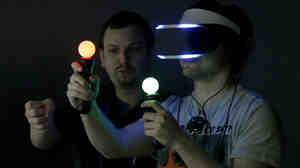 Marcus Ingvarsson (right)  tests out the PlayStation 4 virtual reality headset Project Morpheus in a demo area at the Game Developers Conference 2014 in San Francisco on Wednesday.