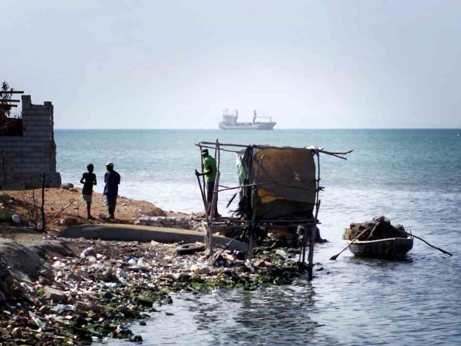 A makeshift latrine hangs over the water at the edge of Cite de Dieu, a slum in Port-au-Prince, Haiti. A makeshift latrine hangs over the water at the edge of Cite de Dieu, a slum in Port-au-Prince, Haiti.