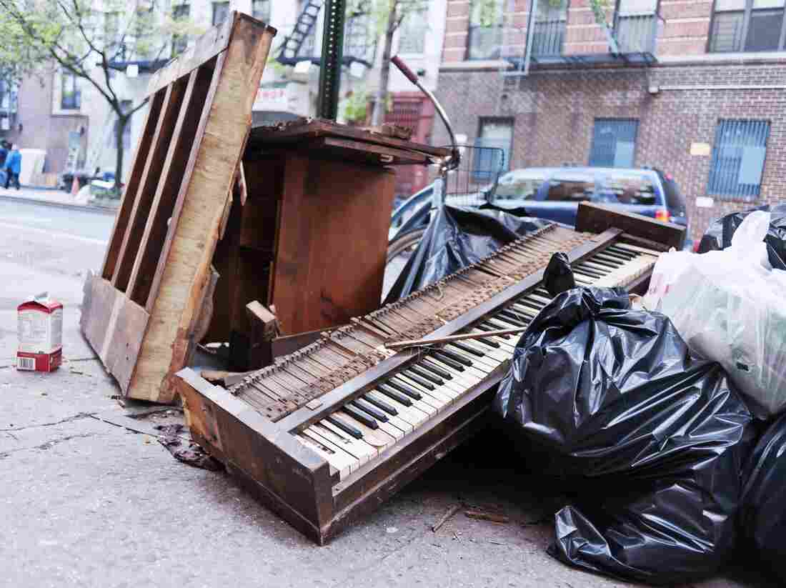 A mangled piano lies in a pile of garbage during cleanup efforts in New York City, following Hurricane Sandy in 2012. A mangled piano lies in a pile of garbage during cleanup efforts in New York City, following Hurricane Sandy in 2012.