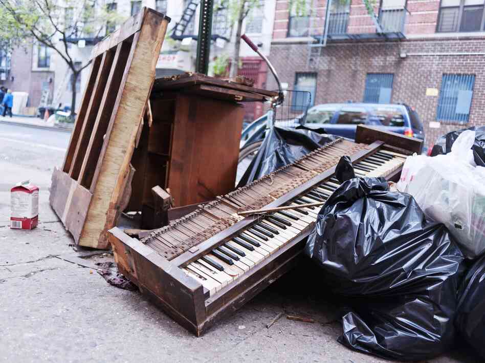 A mangled piano lies in a pile of garbage during cleanup efforts in New York City, following Hurricane Sandy in 2012. A mangled piano lies in a pile of garbage during cleanup efforts in New York City, following Hurricane Sandy in 2012.