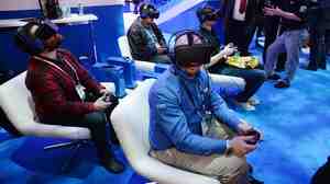 Attendees wear Oculus Rift HD virtual reality headsets at the Consumer Electronics Show in January.