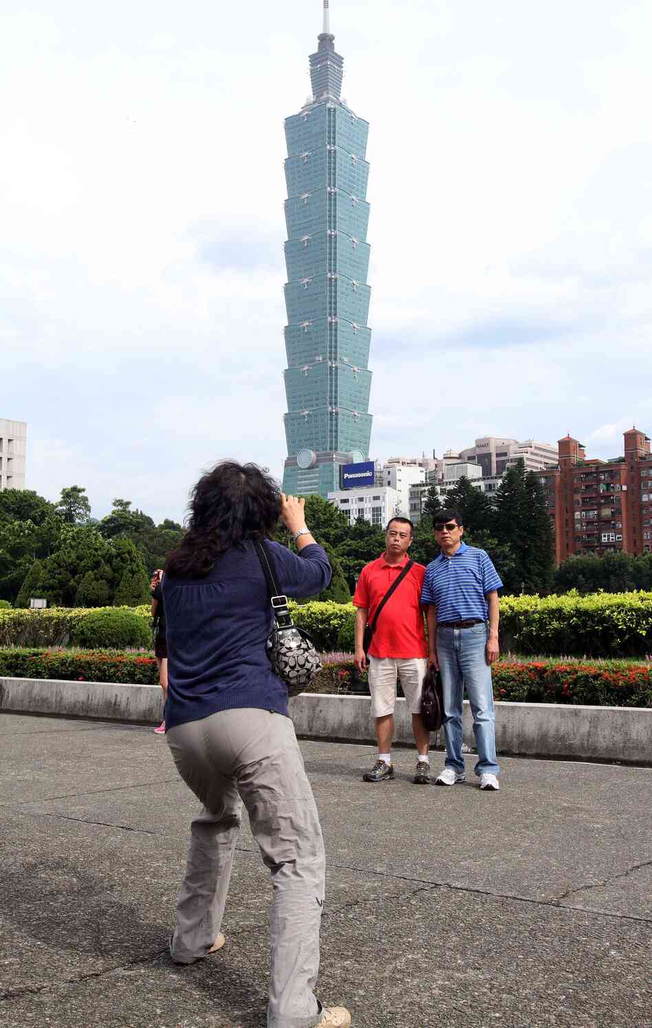 Chinese tourists take photos in front of the Taipei 101 building from the grounds of the Sun Yat-sen memorial hall in Taipei in June 2011. Nearly 3 million tourists from mainland China visited Taiwan last year, up from just 300,000 in 2007. Chinese tourists take photos in front of the Taipei 101 building from the grounds of the Sun Yat-sen memorial hall in Taipei in June 2011. Nearly 3 million tourists from mainland China visited Taiwan last year, up from just 300,000 in 2007.