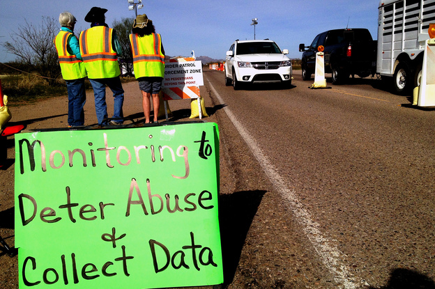 Members of the Arivaca, Ariz., community monitor an immigration checkpoint about 25 miles north of the Mexican border. Some residents say border agents go beyond their legal authority. (Image credit: NPR)