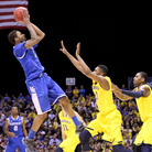 Kentucky's James Young pulls up for a shot against the Michigan Wolverines on Sunday. Kentucky's James Young pulls up for a shot against the Michigan Wolverines on Sunday.