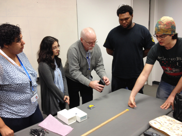 Students from CUNY's AstroCom NYC program meet for a weekly class at the American Museum of Natural History in New York City. Dennis Robbins, an associate professor of science education at CUNY's Hunter College, teaches Betsy Hernandez (from left), Jaquelin Erazo, Ariel Diaz and Mario Martin. (Image credit: WNYC)