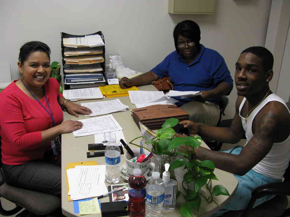 Sandra Rodriguez, a health care navigator for the city of Houston, helps Pamela Thompson and her son Charles Slater evaluate their insurance options on Monday. Sandra Rodriguez, a health care navigator for the city of Houston, helps Pamela Thompson and her son Charles Slater evaluate their insurance options on Monday.