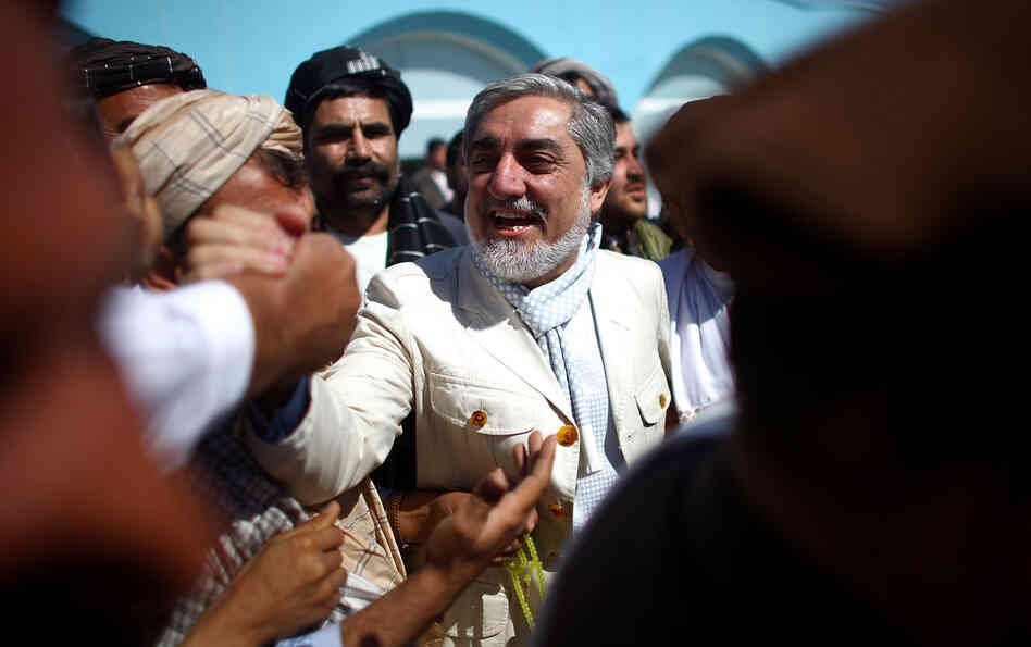 Presidential candidate Dr. Abdullah Abdullah is greeted by well wishers at the Kandahar airport in southern Afghanistan. He finished second in the 2009 presidential election and is one of the leading candidates going into Saturday's voting. Presidential candidate Dr. Abdullah Abdullah is greeted by well wishers at the Kandahar airport in southern Afghanistan. He finished second in the 2009 presidential election and is one of the leading candidates going into Saturday's voting.
